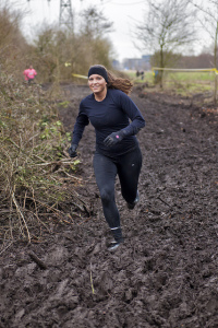 Woman Running Through Thick Mud