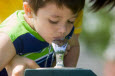 Child drinking out of water fountain