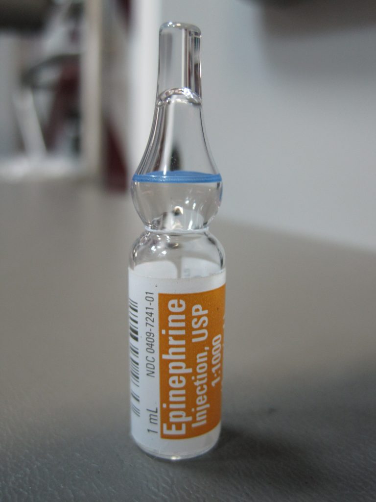 Photo showing closeup of an epinephrine ampule