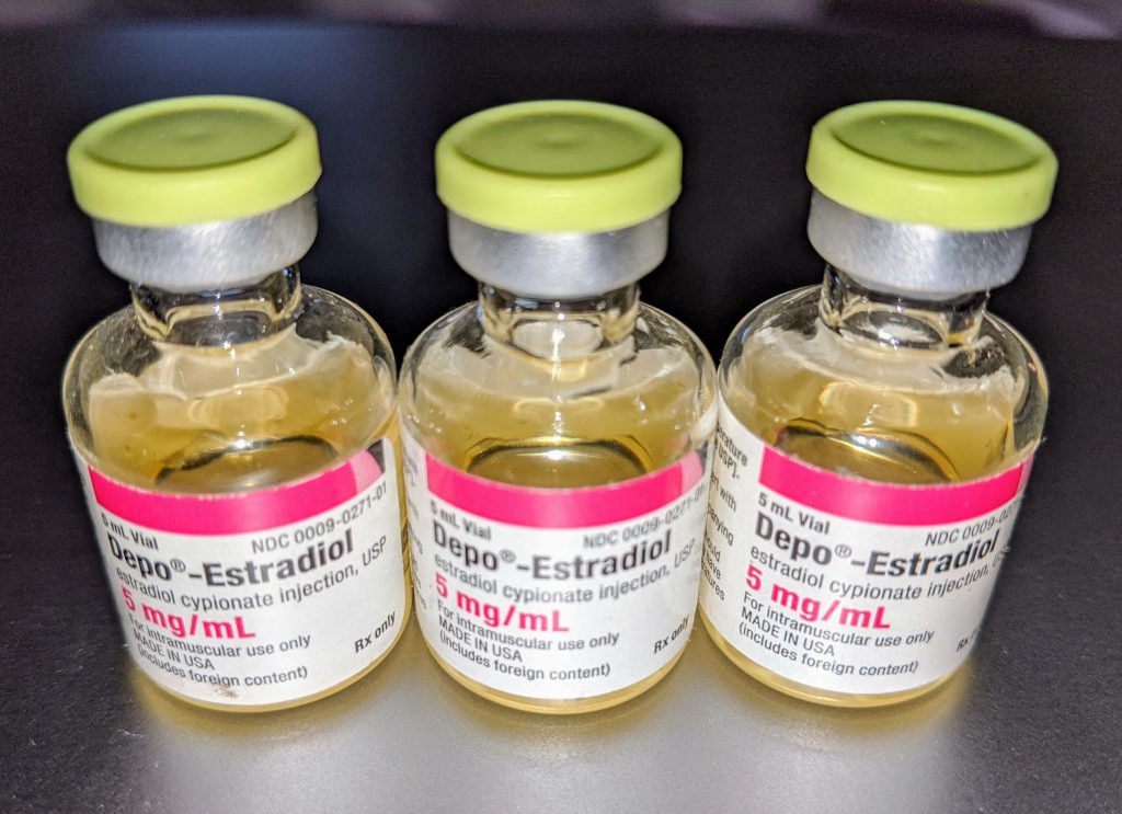 Photo showing closeup of three vials of Depo-Estradiol, with rubber tops