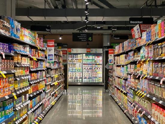 Photo of a grocery store aisle with shelves of food
