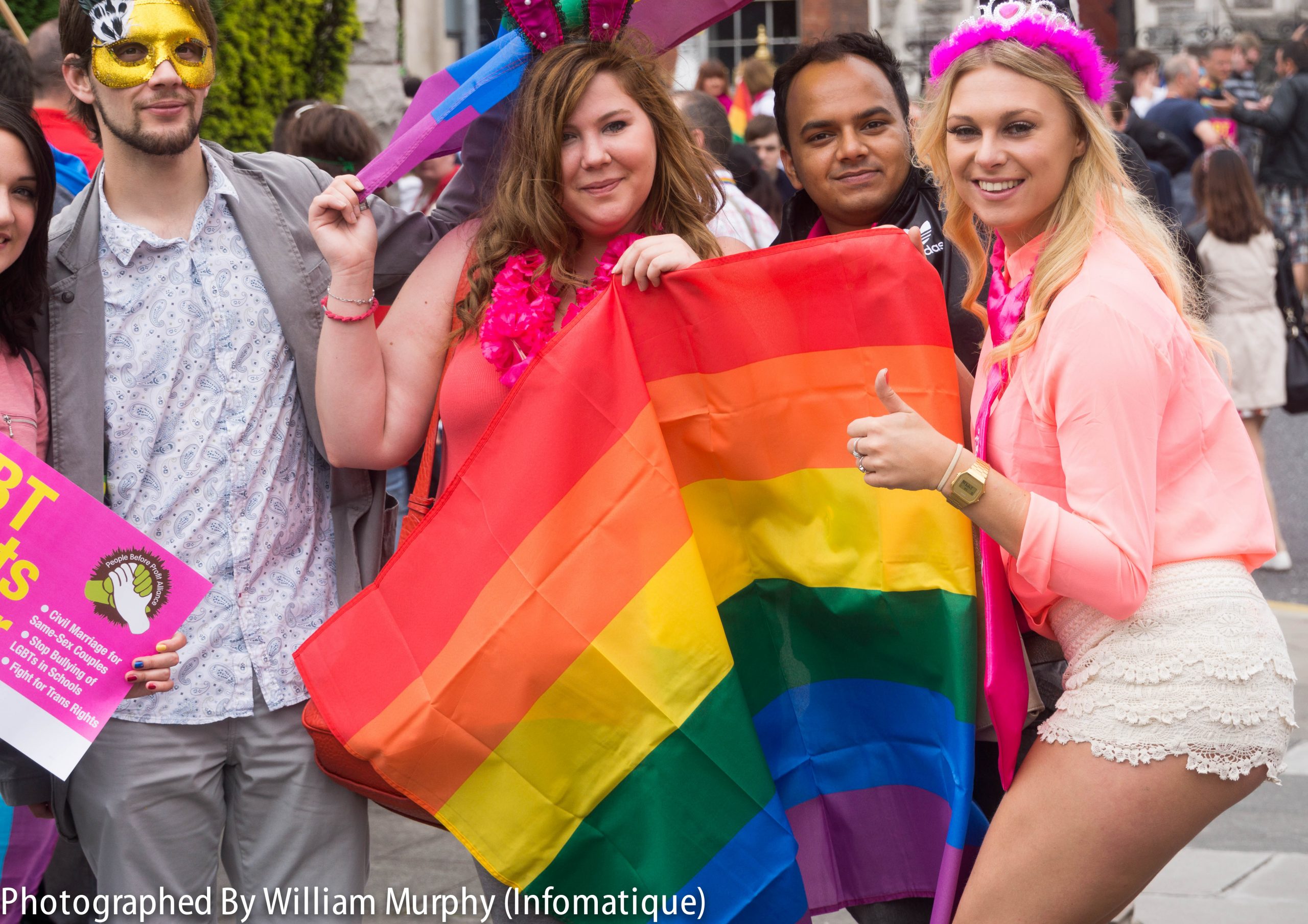 Photo showing a group of four people celebrating Pride Festival for the LGBTQ Population