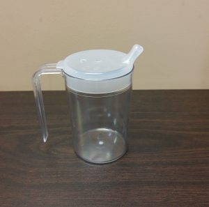 Photo showing a covered cup with handle