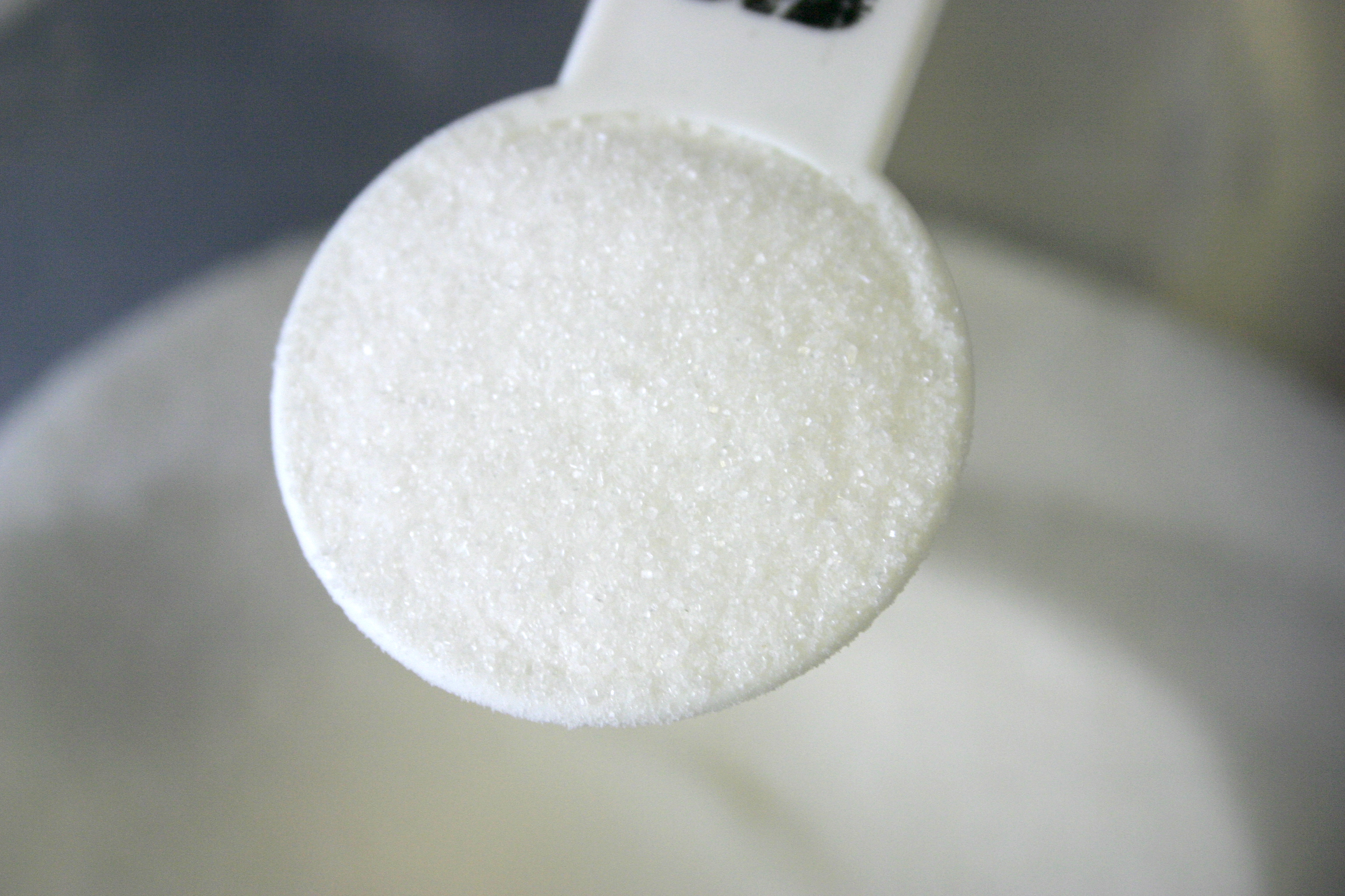 Measuring spoon of sugar.