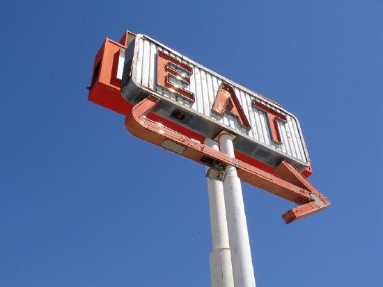 Large roadside sign with Eat.