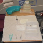 Gather supplies and set up sterile tray