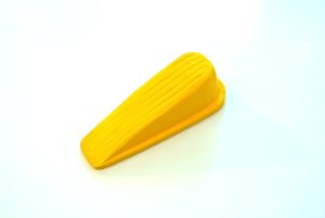 A yellow door stopper is shown.