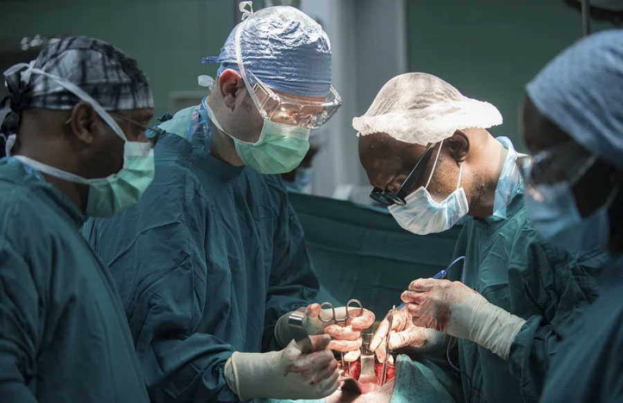 Photo of surgeons operating on a patient.