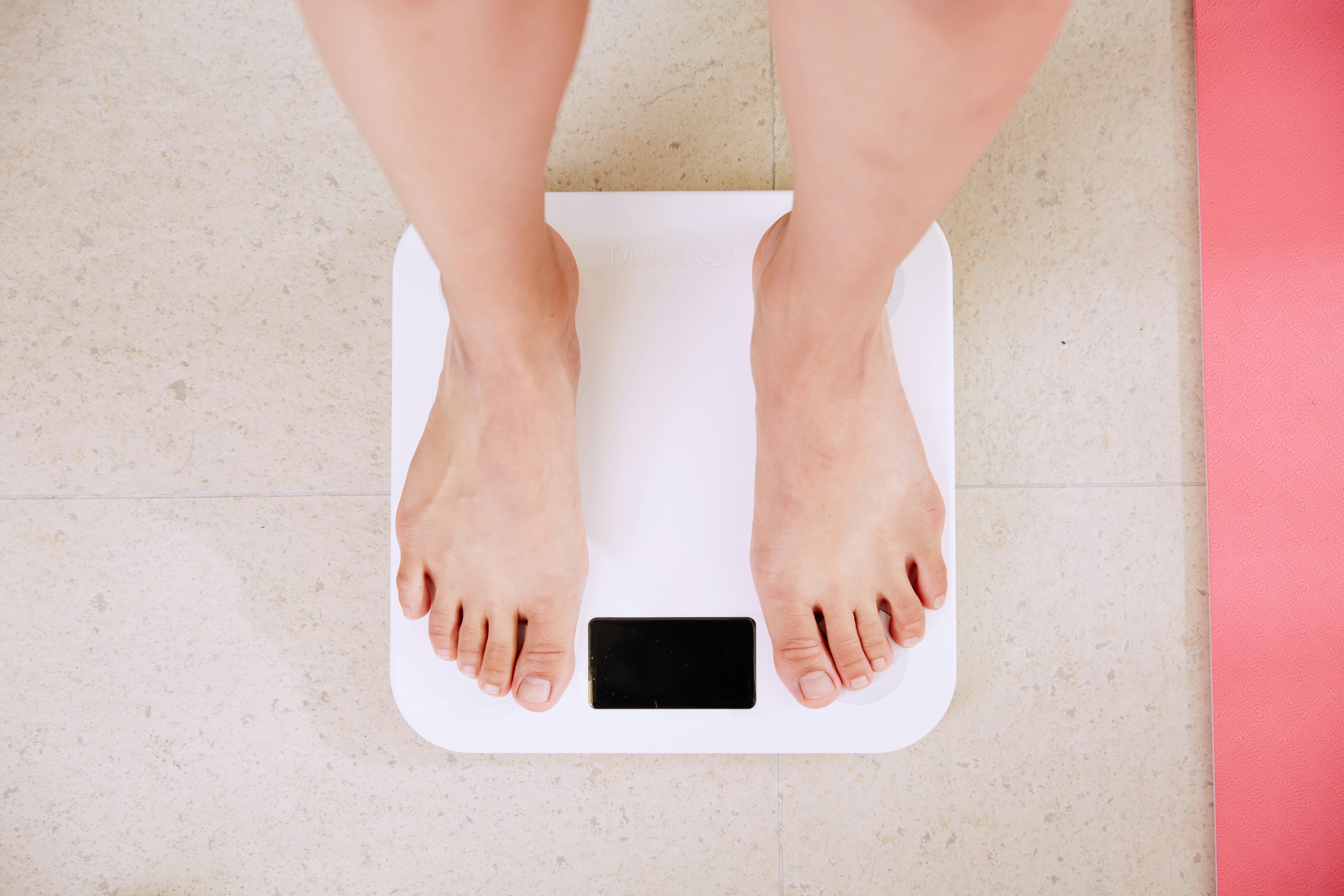 Bare feet on a scale.